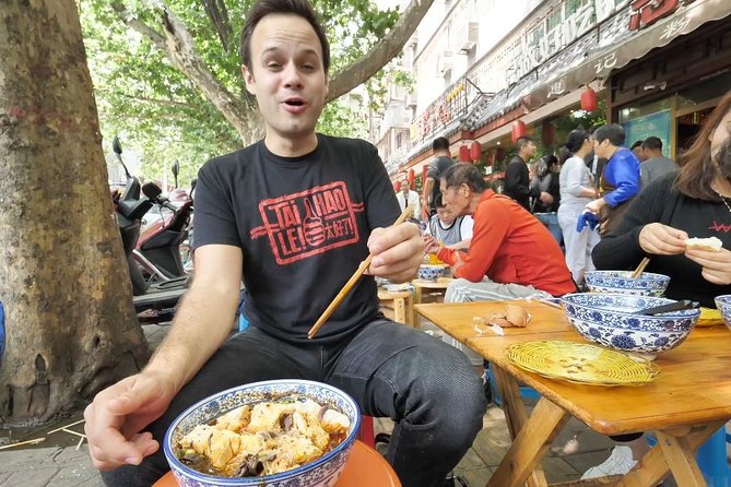 3-Hour Private Night Tour: Beijing Foodie Experience - The Yunnan cuisine stop: flower cake, plum liquor, and Cross Bridge noodles