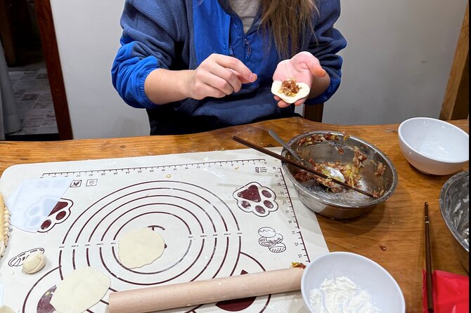 Dumpling Cooking Class and Local Market Tour - English-Speaking Guide and Instructor: Clarity That Makes Cooking Stick